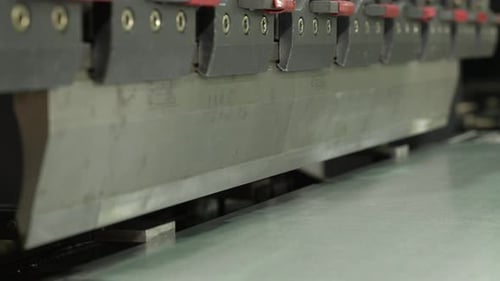 The Employee Hands are Not Bending the Large Parts of the Metal on the Bending Machine Closeup The