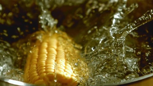 Corn Falls Into Boiling Water Into a Pan Filmed on a Highspeed Camera at 1000 Fps