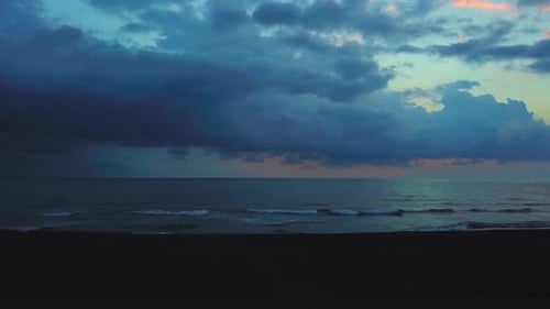 View from above from flying drone to shore of sea and sunset