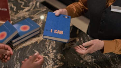 Bookstore Customer Making Payment by Card at Checkout