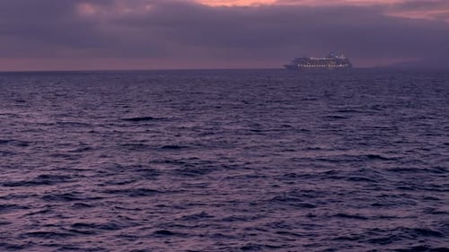 Cruise ship in distance - sailing. Smooth sea.