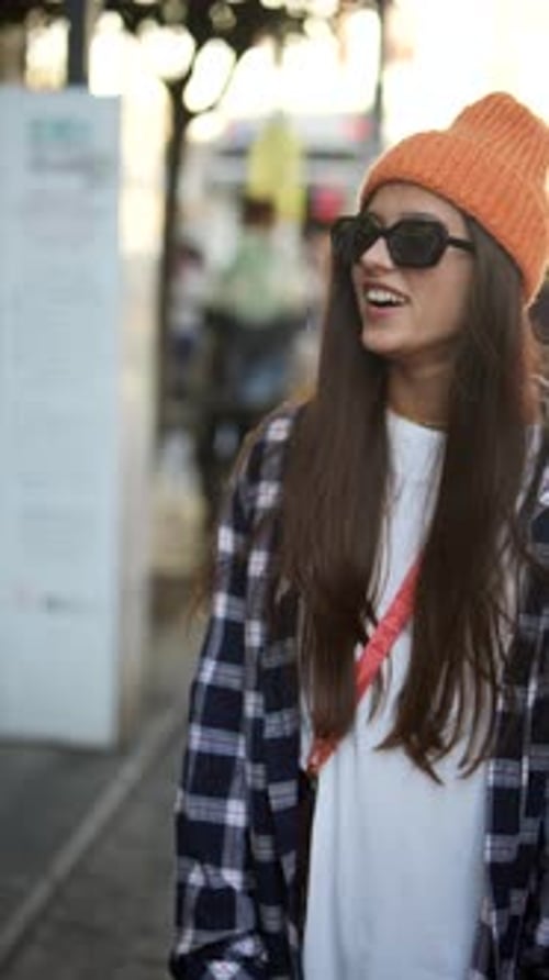 Explore Trendy Urban Fashion Featuring Stylish Sunglasses and a Cozy Beanie Accessory