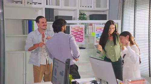 Group of multi-Ethnic businessman and businesswoman dancing in office.