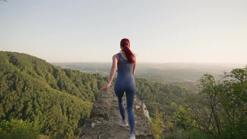 Athletic Woman Runs Edge on Top Mountain Background Beautiful Natural Landscape