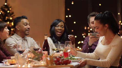 Friends Enjoying Christmas Dinner, Taking Selfie