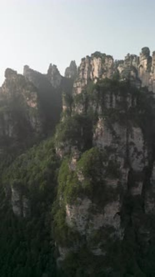 Aerial view of peaks and forests in a breathtaking valley, China.