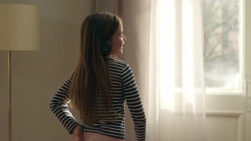 Caucasian Child Kid European Little Girl Daughter Dancing Listening Music in Headphones Listen Sound