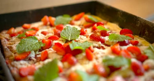 Baked Dessert with Strawberries and Mint in Pan