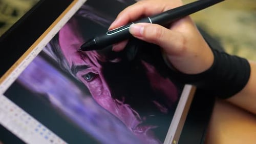 Woman's Hand Drawing on a Tablet