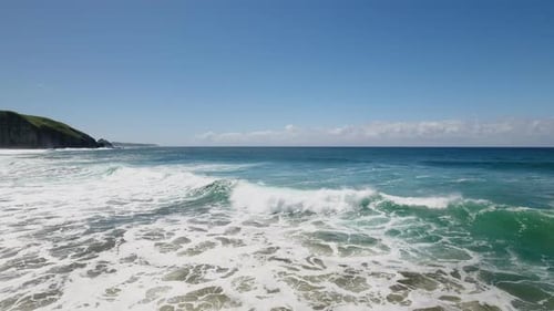 Cinematic aerial ocean surfing along coast of South Africa