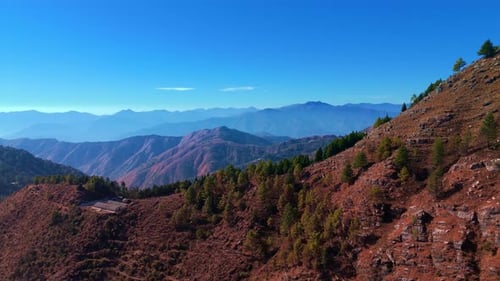 beautiful mountains range with trees with clear blue sky in chakrata dehradun