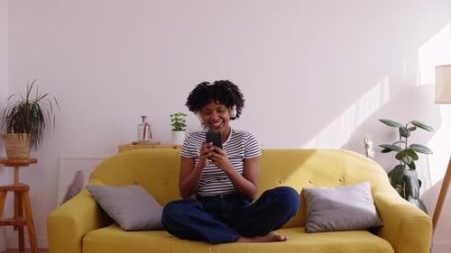 Woman Listening to Music, Dancing on Couch