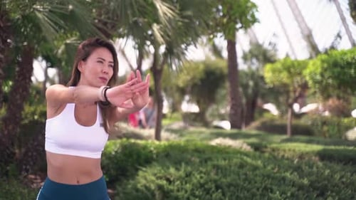 Woman Stretching in Urban Park