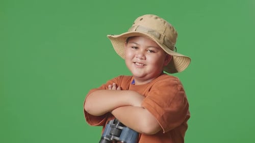 Tourist Boy Researcher Crossing Arms And Smiling On Green Screen Background
