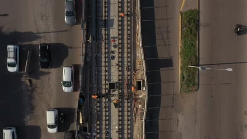 Aerial shot of workers at a tramway workingsite in a busy boulevard