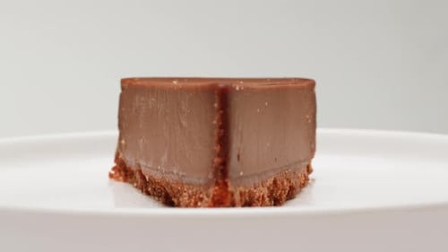 Decadent Chocolate Cheesecake Slice on White Plate