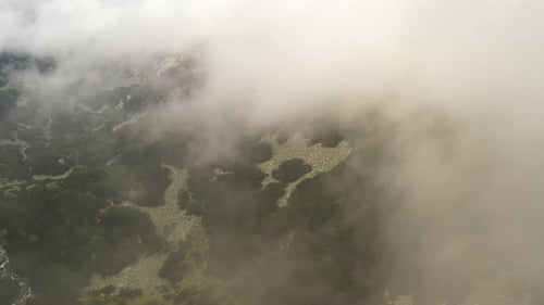 Flight In The Clouds Over Pirin Mountain In Bulgaria