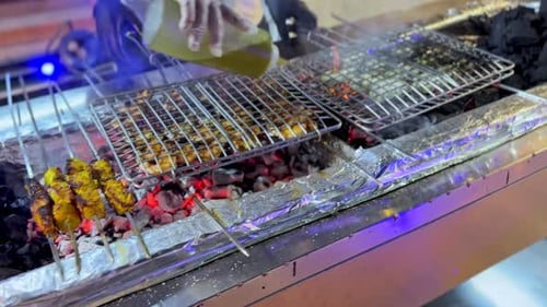 Chef Flipping Grill Grate Over Intense Charcoal Fire