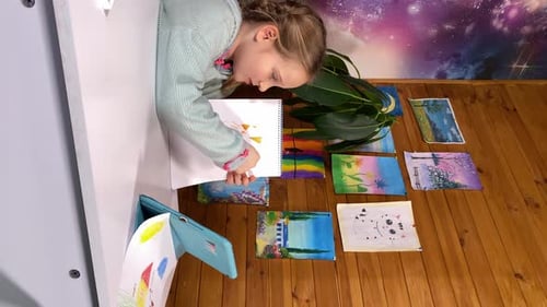Young Girl Drawing at Home with Colorful Markers