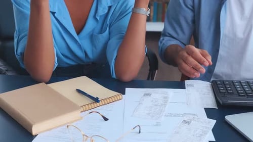 Hands of Office Workers Sits at Table with Calculator and Financial Documents
