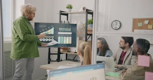 Ambitious Businessman Making Presentation Sharing Ideas with Colleagues Diverse Team in Office