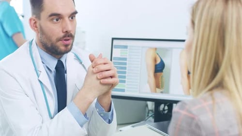 Doctor Explains Procedure to Blonde Woman in Office