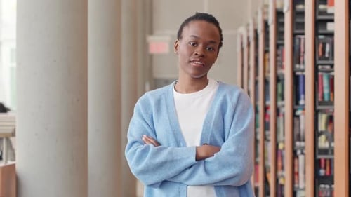 Happy Black African Girl Student Standing in University Library Portrait