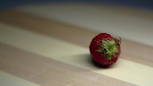 close up of a red berry with a rotating shot