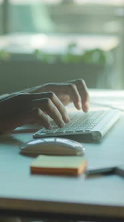 Dedicated Individual Engaged in Office Tasks Concentrated Professional Utilizing Computer in