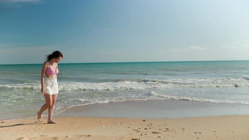 Beautiful Adult Brunette Woman on a Sandy Seashore