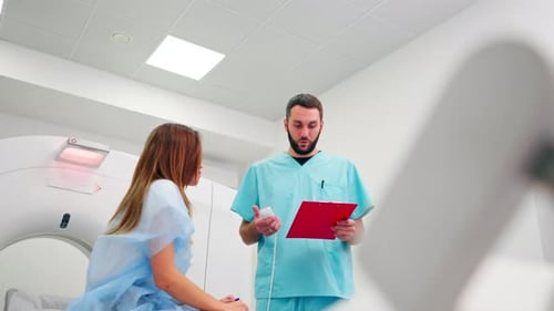 Doctor Explaining Medical Procedure to Young Female Patient