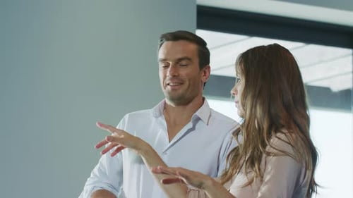 Cheerful Couple Planning Home Interior Design