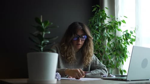 Young Woman Getting Frustrated Working at Home Office