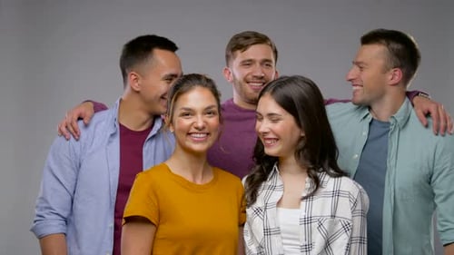 Smiling Young Adults Pose in a Studio