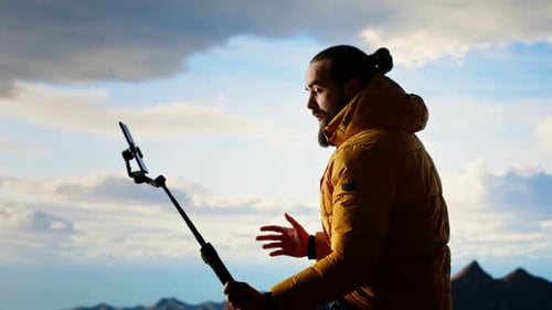 Content Creator Records a Vlog in the Mountains Sharing His Outdoor Adventure
