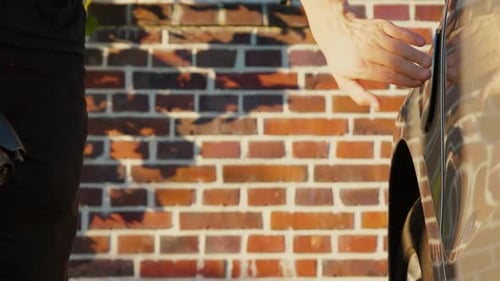 Connecting Electric Car to Charging Cable