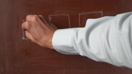 Textured Brown Chalkboard Background Male Hand Drawing a Tick a Cross and a Circle Inside of Three