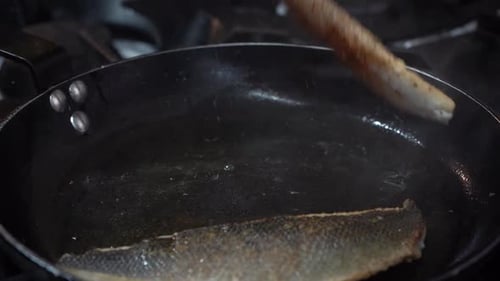 Frying fresh fish. Turn it on the other side.