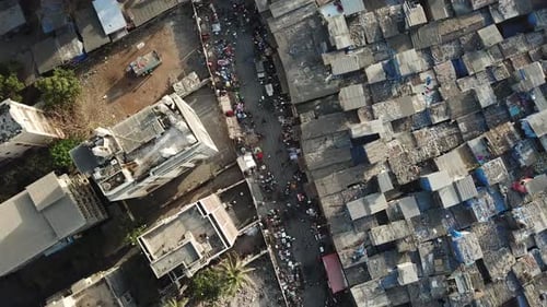Mumbai India, Dharavi Slum, Top Down Birdseye Aerial View on Busy Street and Residental Buildings