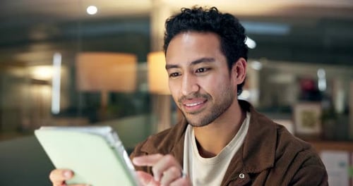 Tablet, reading and businessman in office for research on creative project with online blog