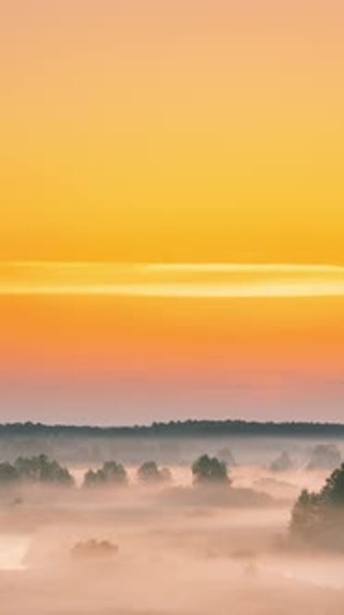 Amazing Sunrise Over Misty Landscape Scenic View Of Foggy Morning Sky With Rising Sun Above Misty