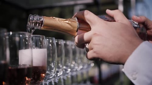 Champagne Pouring into Glasses for Wedding Celebration