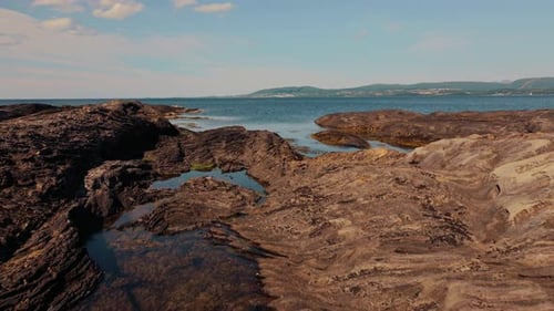 Aerial Glimpse at Volcanic Rocky Norway Sunlit Stone Textures Amidst the Wild Beauty