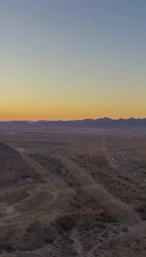 Traffic on Highway in Desert at Sunset Arizona USA Aerial View Vertical Video