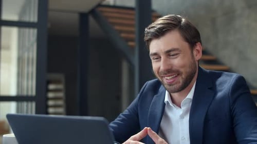 Portrait Of Joyful Businessman Making Video Call On Laptop In Home Office. Handsome Business Man ...