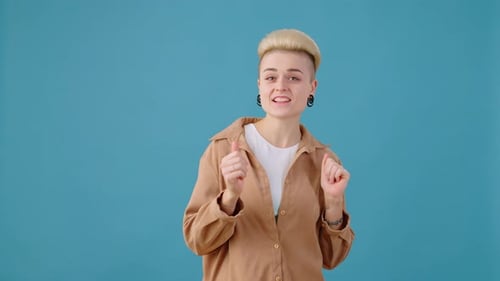 Smiling Woman Gesturing on Blue Background