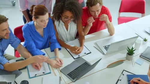 Top View Young Multiethnic Team Working With Computer Together In Meeting Room. Business People P...