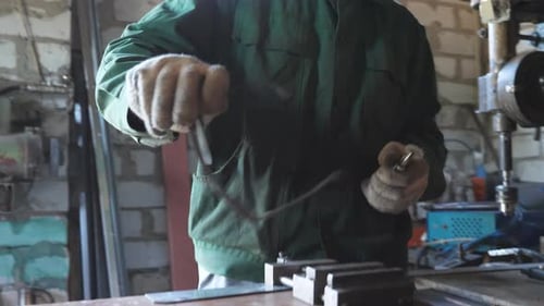 Young Repairer Putting on Protective Glasses to Get to Work with Metal Details at Workshop Male
