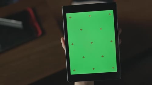 Female Hand Swiping Green Screen Tablet Pc. Close Up Woman Using Tablet
