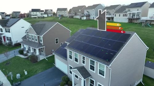 Suburban home with rooftop solar panels and an animated energy efficiency rating scale. Aerial view